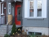 Grey house with red door